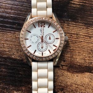 White/cream watch band, rose gold details